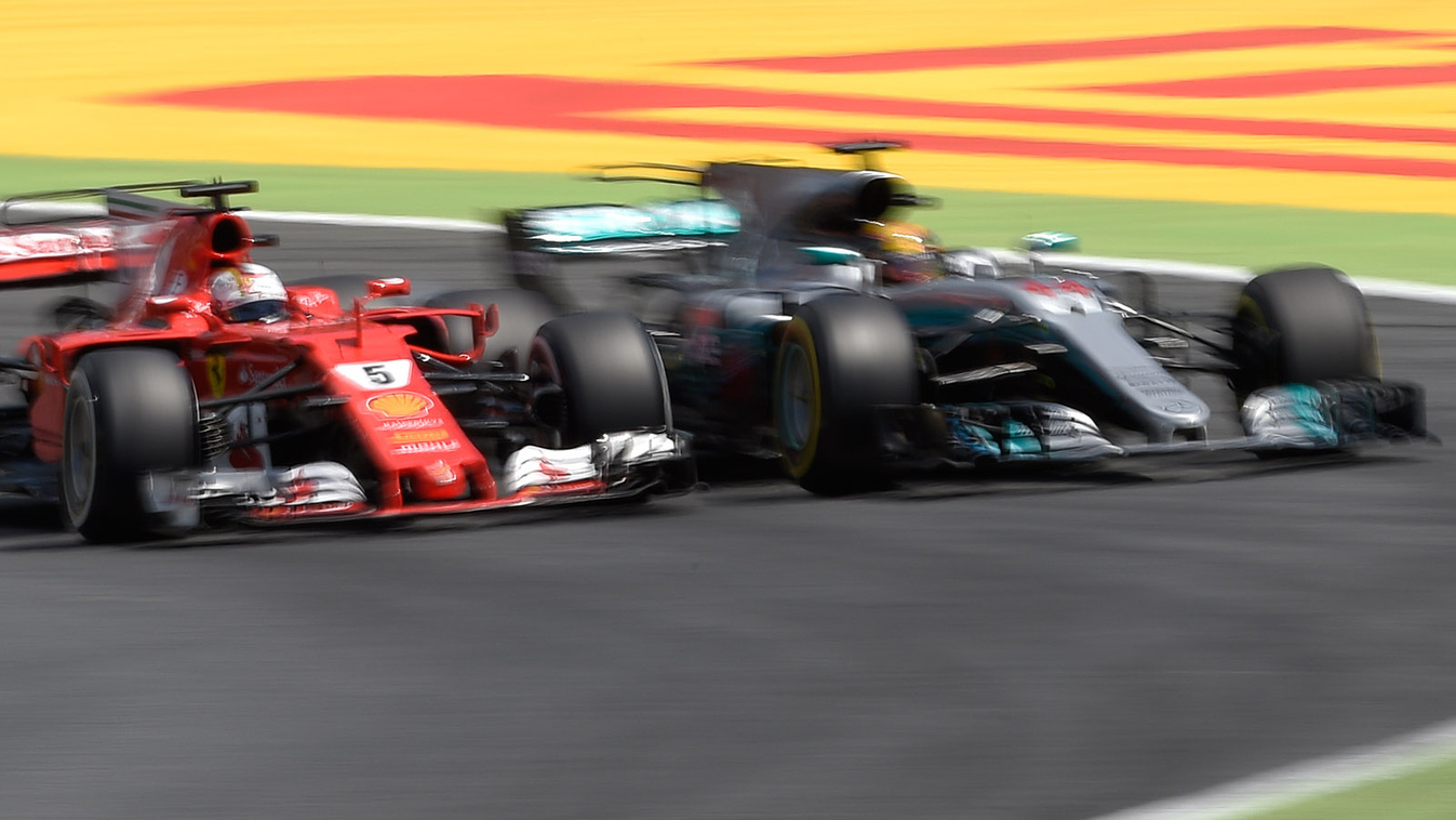 Horizontal Mercedes' British driver Lewis Hamilton and Ferrari's German driver Sebastian Vettel race at the Circuit de Catalunya on May 14, 2017 in Montmelo on the outskirts of Barcelona during the Spanish Formula One Grand Prix. / AFP PHOTO / LLUIS GENE 