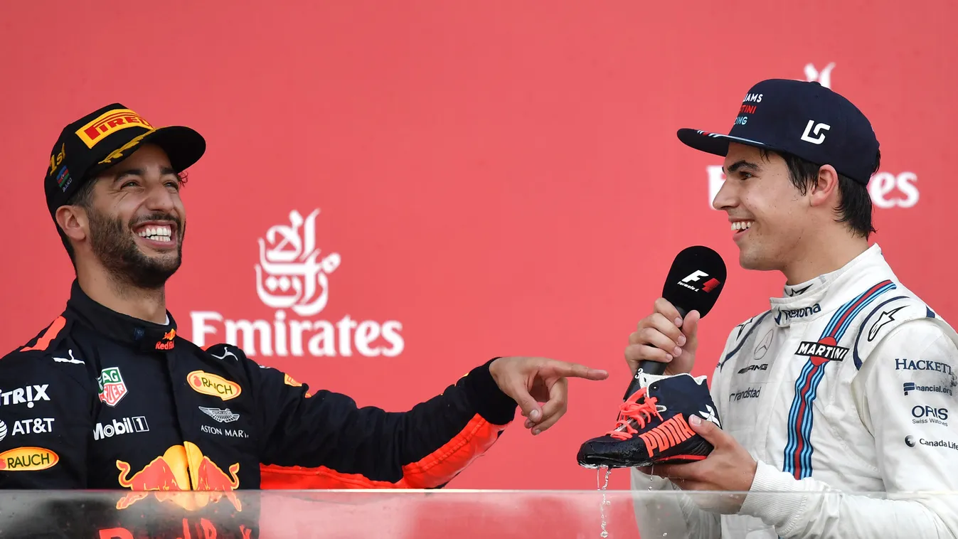auto-prix auto Horizontal Winner Red Bull's Australian driver Daniel Ricciardo (L) and third placed Williams' Canadian driver Lance Stroll celebrate on the podium after the Formula One Azerbaijan Grand Prix at the Baku City Circuit in Baku on June 25, 201