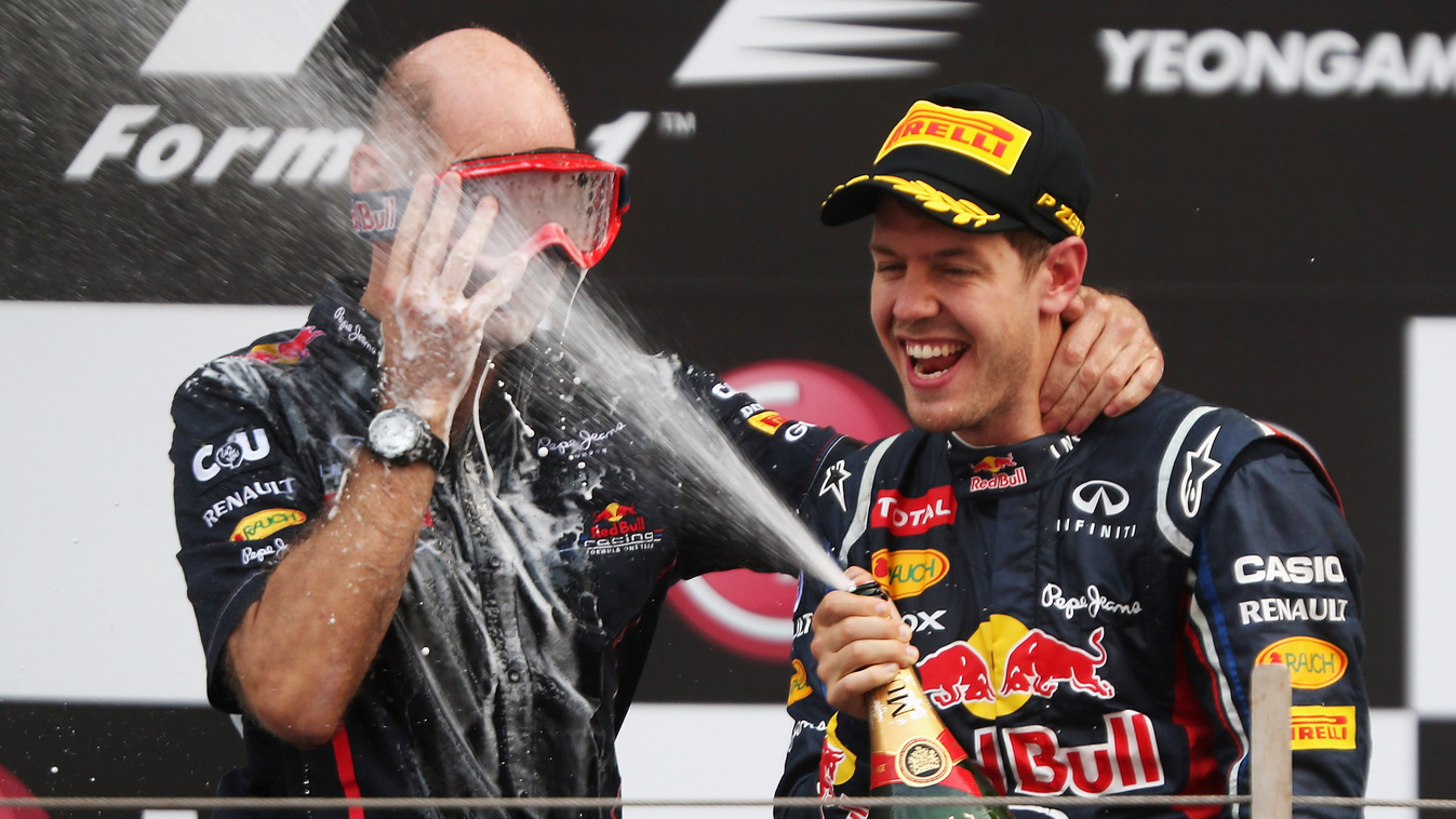 F1 Grand Prix of Korea P-20141222-13360 YEONGAM-GUN, SOUTH KOREA - OCTOBER 14:  Red Bull Racing Chief Technical Officer Adrian Newey wears mechanics goggles to protect his eyes as race winner Sebastian Vettel of Germany and Red Bull Racing sprays champagn