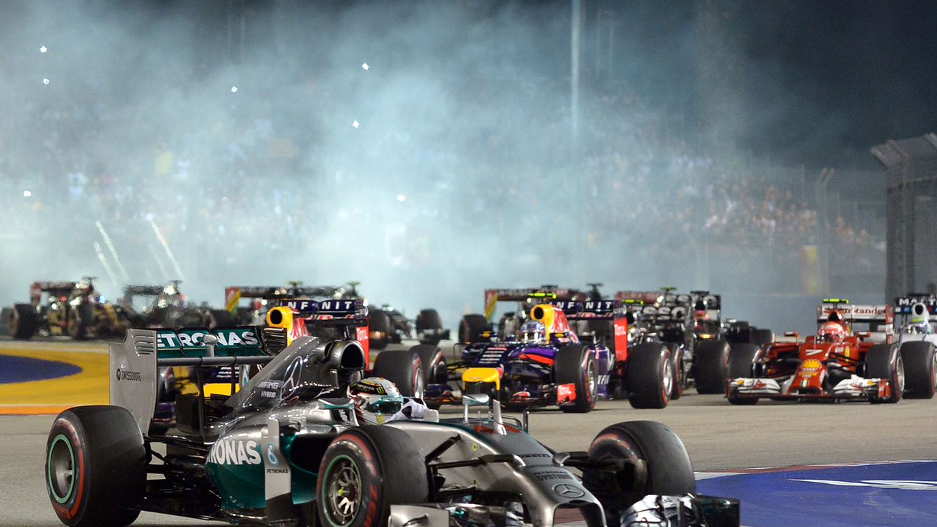 Mercedes driver Lewis Hamilton of Britain leads the pack during the Formula One Singapore Grand Prix at the Marina Bay street circuit on September 21, 2014. AFP PHOTO / MOHD RASFAN 