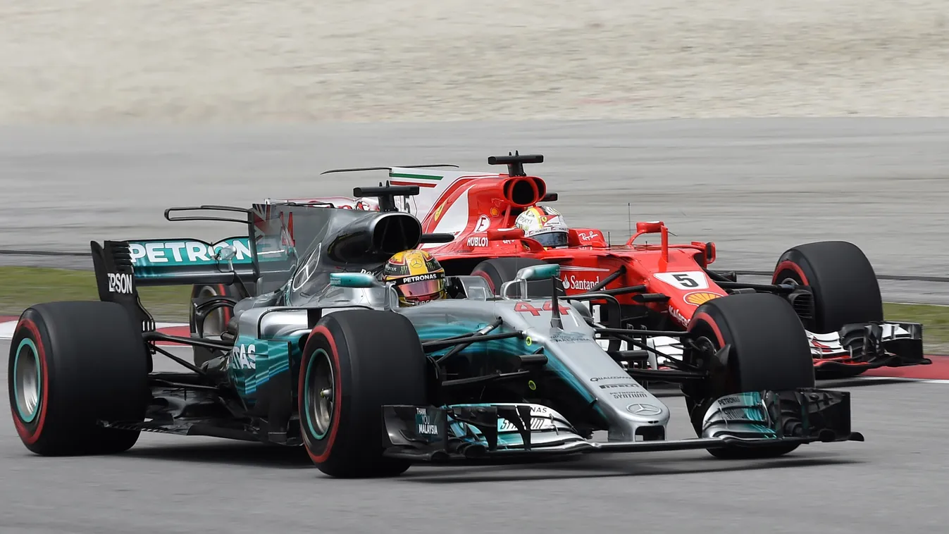 auto-prix Horizontal (FILES) This file photo taken on September 30, 2017 shows Mercedes' British driver Lewis Hamilton (front) and Ferrari's German driver Sebastian Vettel driving during the third practice session of the Formula One Malaysia Grand Prix at
