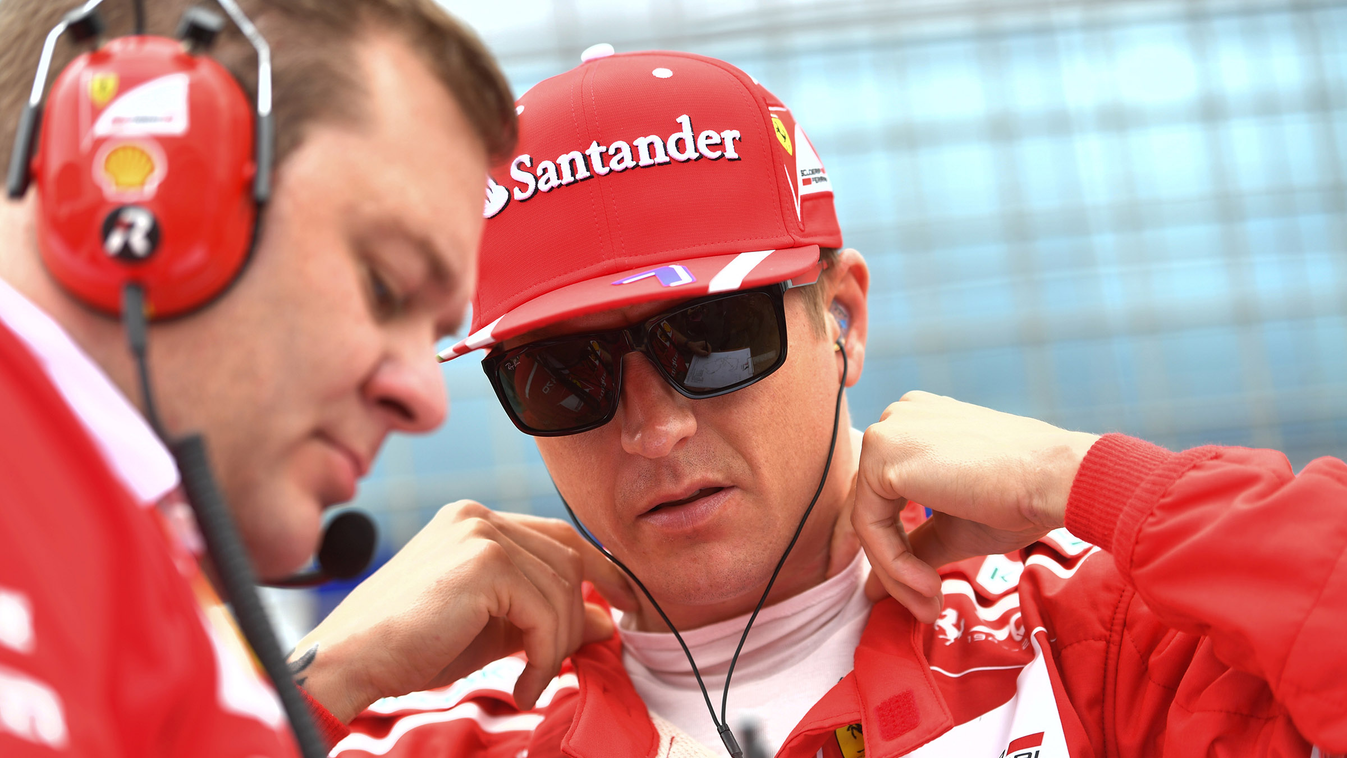 Horizontal Ferrari's Finnish driver Kimi Raikkonen (R) speaks with a technician ahead of the British Formula One Grand Prix at the Silverstone motor racing circuit in Silverstone, central England on July 16, 2017. / AFP PHOTO / Andrej ISAKOVIC 