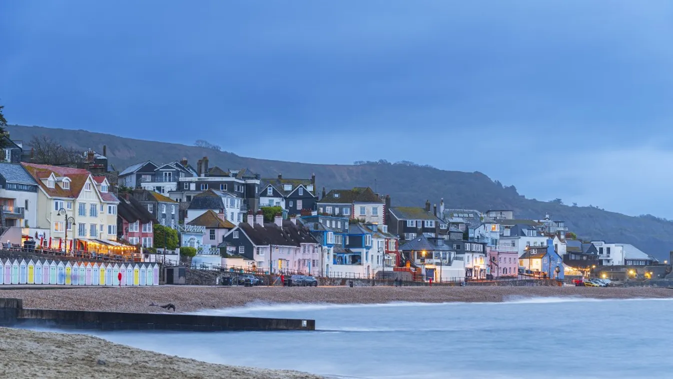 View from the beach of the colouful village of Lyme Regis at dusk, Jurassic Coast, UNESCO World Heritage Site, Dorset, England, United Kingdom, Europe Travel Destinations Travel Color Image Outdoors Dusk No People UK Copy Space Dorset England Jurassic Coa