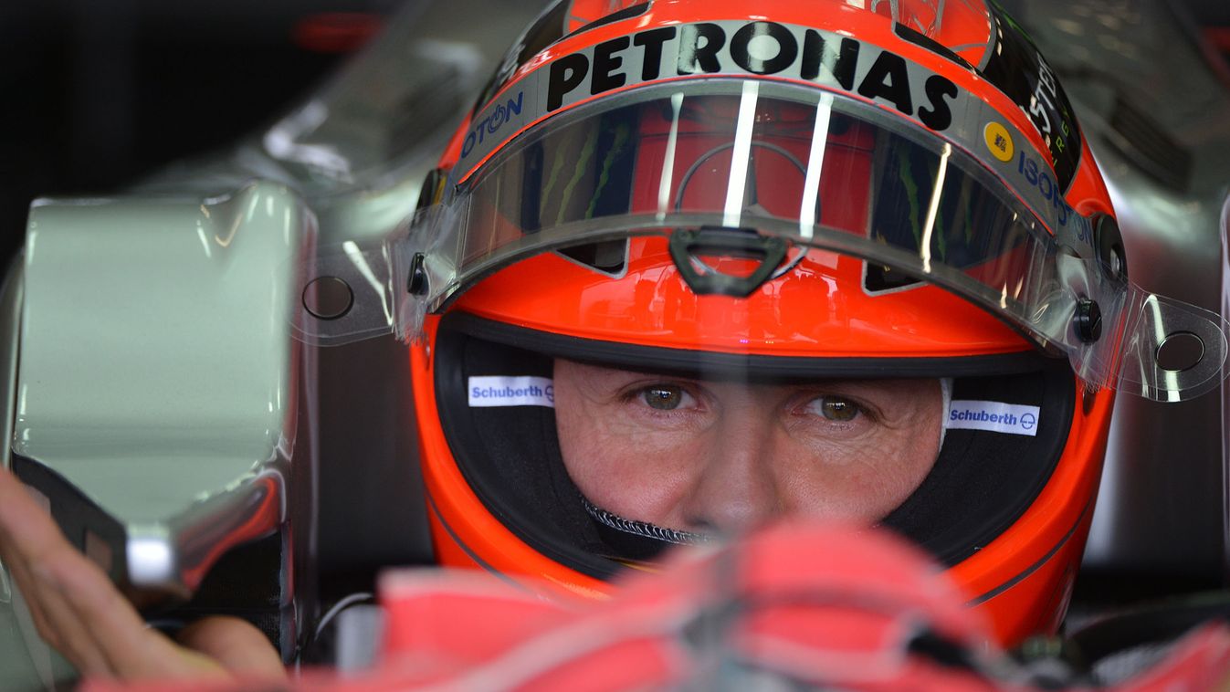 Mercedes'  German driver Michael Schumacher sits in the pits during the third practice session at the Silverstone circuit on July  7, 2012  ahead of the British Formula One Grand Prix.    AFP PHOTO / BEN STANSALL 