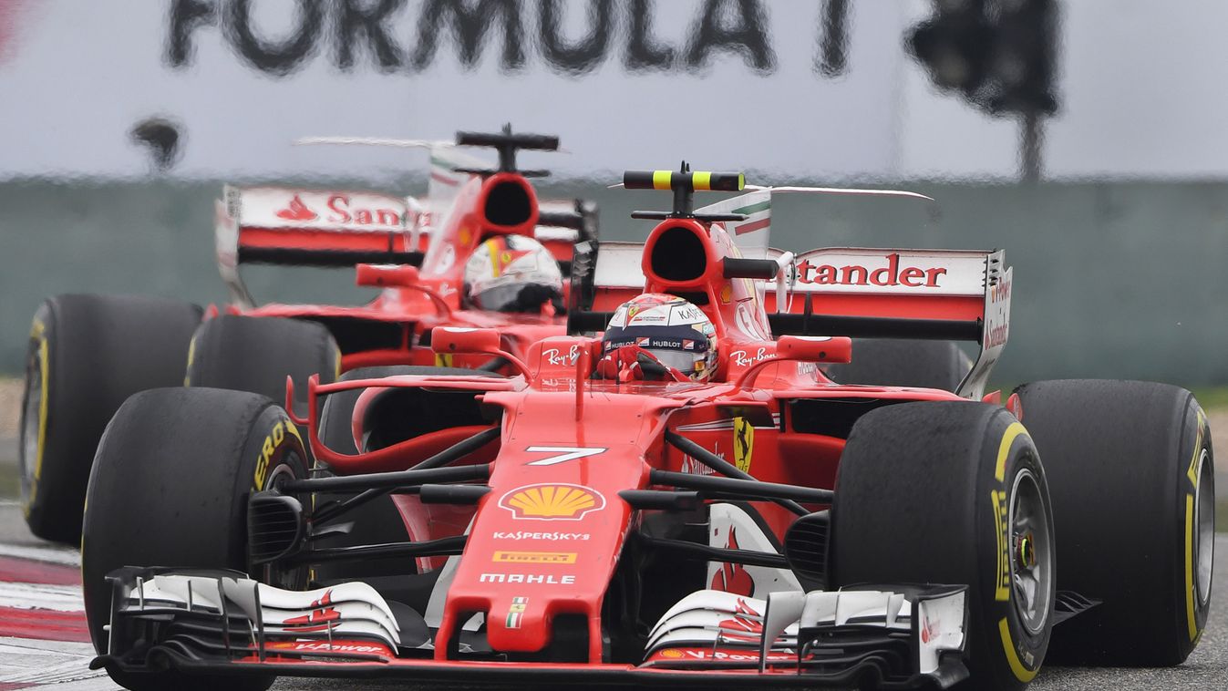 auto-prix Horizontal Ferrari's Finnish driver Kimi Raikkonen takes a corner ahead of teammate Sebastian Vettel during the Formula One Chinese Grand Prix in Shanghai on April 9, 2017.  / AFP PHOTO / GREG BAKER 
