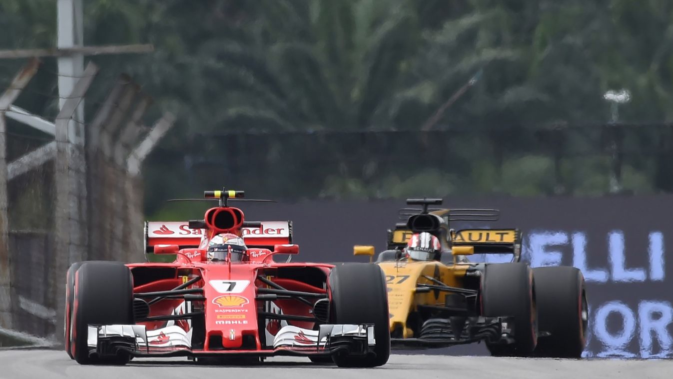 Horizontal Ferrari's Finland driver Kimi Raikkonen (front) and Renault's German driver Nico Hulkenberg (behind) compete during their second practice session of the Formula One Malaysia Grand Prix at the Sepang circuit near Kuala Lumpur on September 29, 20