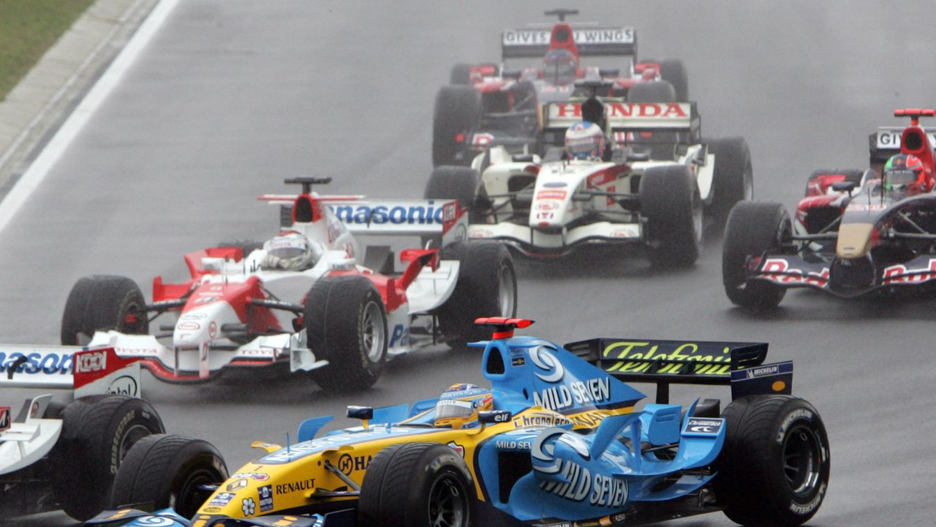 Formula One 2006 Hungarian Grand Prix  - Fernando Alonso Motor_Racing SPO Sports action curve f_1 formula_1 formula_one group race_cars HORIZONTAL Spanish Formula One driver Fernando Alonso of the Renault F1 team is pictured amongst the pack at the Hungar