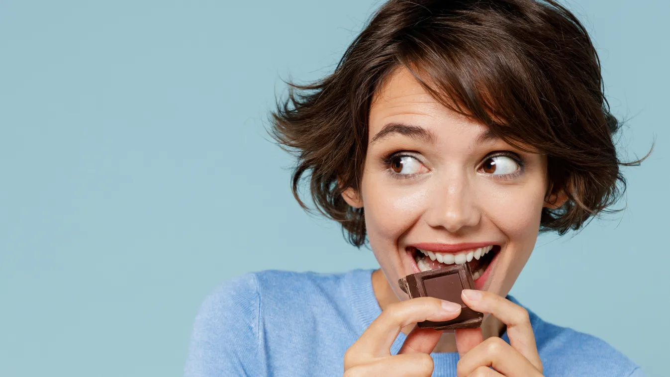 Close,Up,Young,Happy,Woman,In,Casual,Sweater,Hold,Sweet, chocolate, csoki, csokoládé