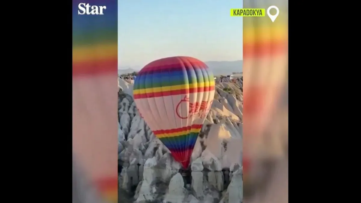 Egy utasokkal teli hőlégballon rekedt a sziklák között - videó