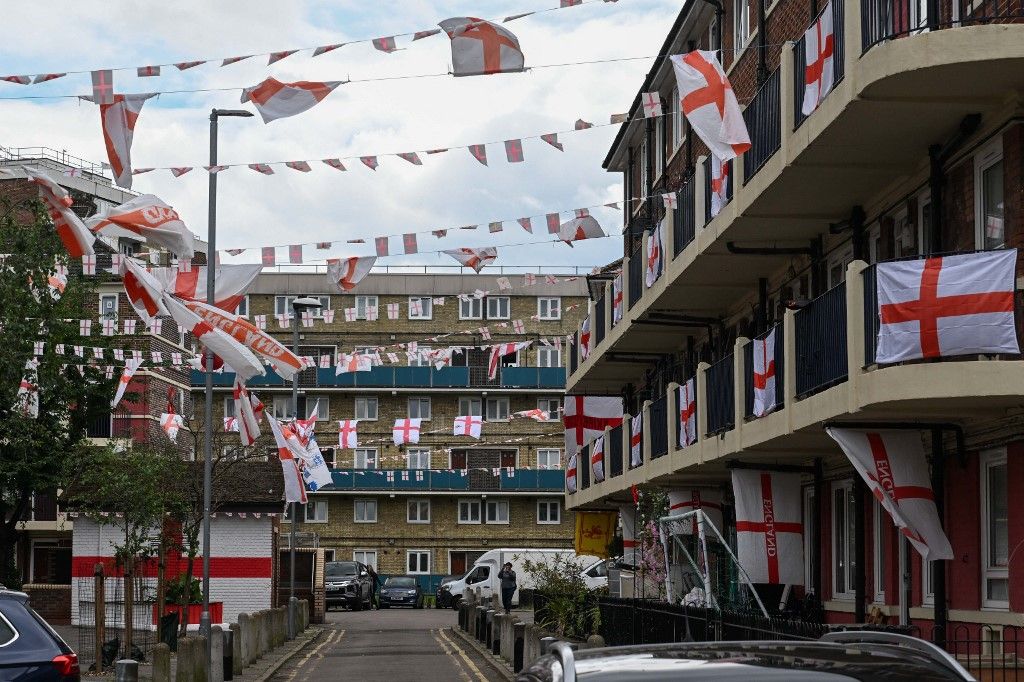 Citizens decorate their balconies with British flags in London