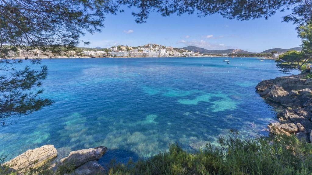 tenger View of rocky shoreline by turquoise sea and Santa Ponsa, Majorca, Balearic Islands, Spain, Mediterranean, Europe