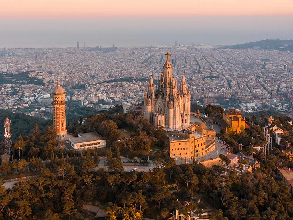 Aerial,View,Of,Barcelona,Skyline,With,Sagrat,Cor,Temple,During