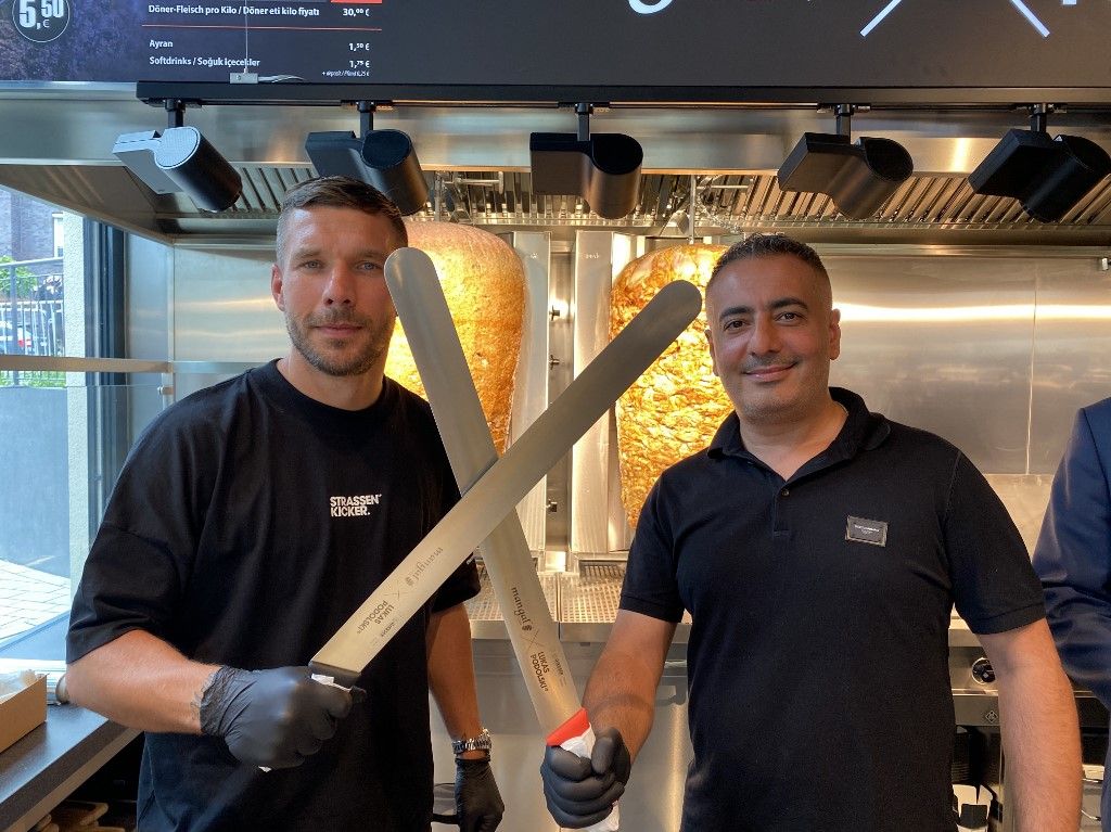 German footballer Lukas Podolski opens the 11th branch of his chain Doner Kebab restaurant in Cologne