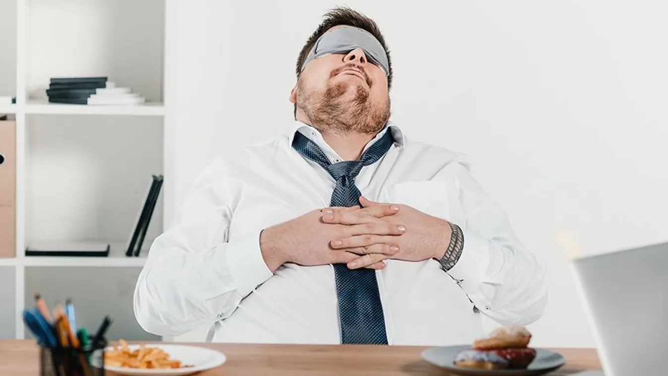 Overweight,Businessman,In,Sleeping,Mask,Relaxing,At,Workplace