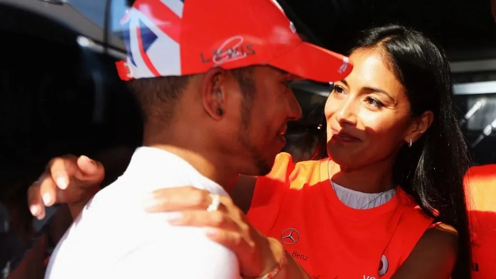 MONTREAL, CANADA - JUNE 10: Lewis Hamilton of Great Britain and McLaren Mercedes celebrates with his girlfriend Nicole Scherzinger of the Pussycat Dolls after winning the Canadian Formula One Grand Prix at the Circuit Gilles Villeneuve on June 10, 2012 in Montreal, Canada. Mark Thompson/Getty Images/AFP (Photo by Mark Thompson / GETTY IMAGES NORTH AMERICA / Getty Images via AFP)