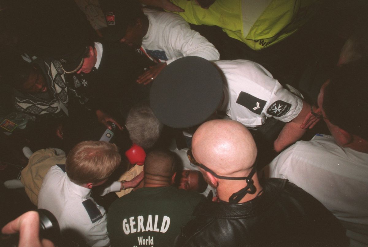 25 FEB  1995:  GERALD MCCLELLAN OF THE USA COLLAPSES IN HIS CORNER AFTER BEING STOPPED BY NIGEL BENN OF GREAT BRITAIN IN THE TENTH ROUND OF THEIR WBC SUPER-MIDDLEWEIGHT WORLD TITLE FIGHT AT THE LONDON ARENA, LONDON DOCKLANDS. Mandatory Credit: John Gichigi/ALLSPORT