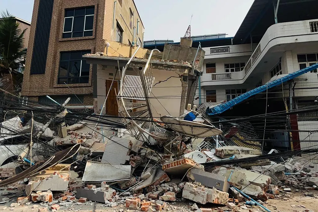 A collapsed building is pictured in Mandalay on March 28, 2025, after an earthquake in central Myanmar. A powerful earthquake rocked central Myanmar on March 28, buckling roads in capital Naypyidaw, damaging buildings and forcing people to flee into the s