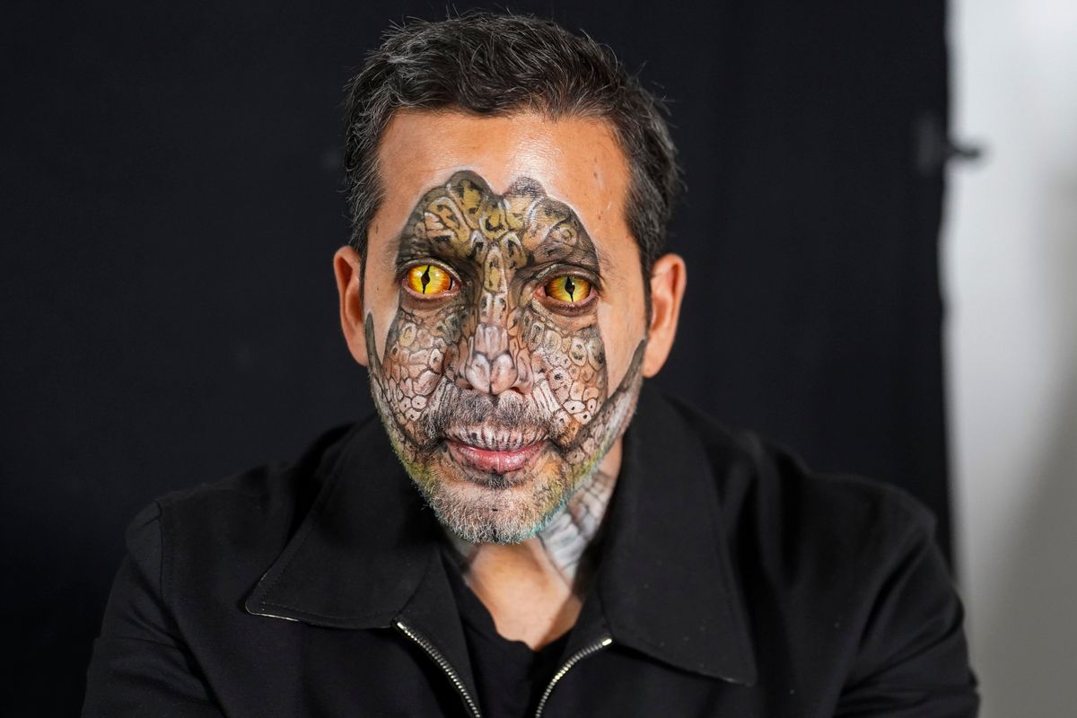 David Blaine poses with his reptile-painted face and contact lenses.   (credit: National Geographic/Dana Hayes)