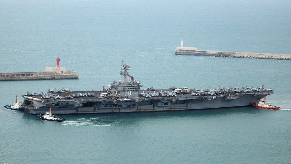 The USS Carl Vinson, a US nuclear-powered aircraft carrier, arrives at a South Korean naval base during its port visit in the southeastern port city of Busan on March 2, 2025. (Photo by YONHAP / AFP) / - South Korea OUT / NO ARCHIVES -  RESTRICTED TO SUBSCRIPTION USE
