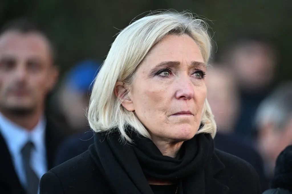 (FILES) Marine Le Pen leave after her father Jean-Marie Le Pen's funeral in his hometown of La Trinite-sur-Mer on January 11, 2025. A French court on March 31, 2025 convicted far-right leader Marine Le Pen on charges of embezzlement of public funds over a fake jobs scam at the EU parliament, a ruling which could derail her 2027 presidential hopes. (Photo by Sebastien Salom-Gomis / AFP)