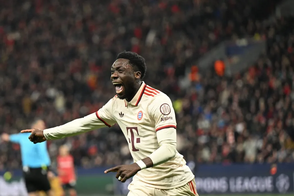 (FILES) Bayern Munich's Canadian defender #19 Alphonso Davies celebrates after scoring the 0-2 goal during the EFA Champions League last 16, second leg, football match between Bayer Leverkusen and Bayern Munich in Leverkusen, western Germany on March 11, 2025. Bayern Munich are facing the prospect of battling for both the league title and the Champions League without key players Dayot Upamecano and Alphonso Davies, who returned from international duty injured, the German giants said on March 26, 2025. (Photo by INA FASSBENDER / AFP)