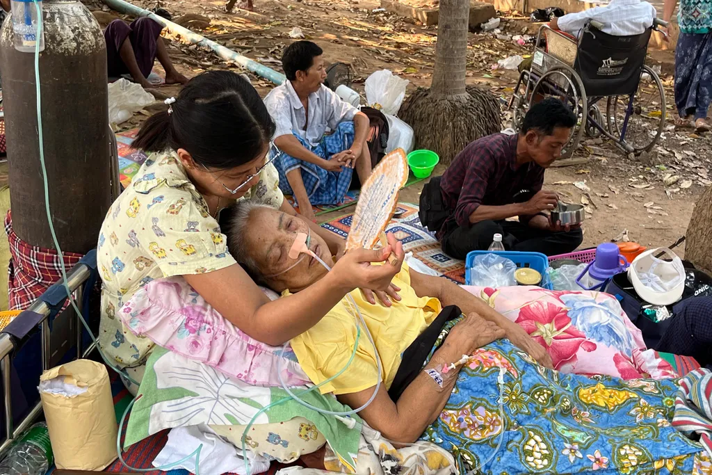 Earthquake survivors wait to receive medical attention in the compounds of a hospital in Naypyidaw on March 28, 2025, after an earthquake in central Myanmar. A powerful earthquake hit Myanmar and neighbouring Thailand on March 28, turning a major hospital