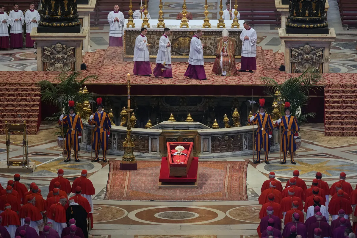 The body of Pope Francis lies in state at St Peter's Basilica, on April 23, 2025. The Pope died of a stroke, the Vatican announced hours after the death on April 21, 2025, of the 88-year-old reformer who inspired devotion but riled traditionalists during 12 years leading the Catholic Church. (Photo by Andrew Medichini / POOL / AFP)