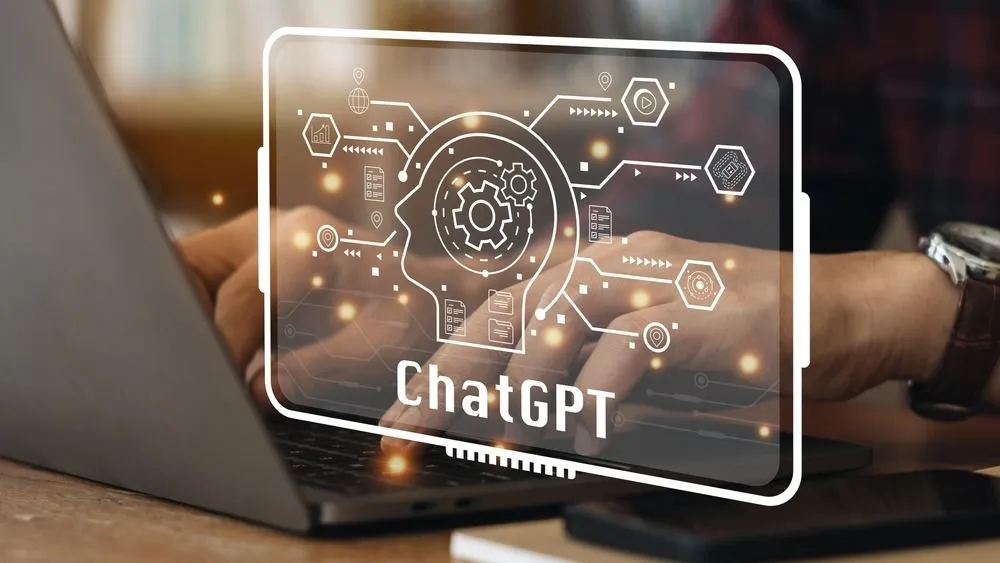 ChatGPT Chat with AI or Artificial Intelligence. Young businessman chatting with a smart AI or artificial intelligence using an artificial intelligence chatbot developed by OpenAI.