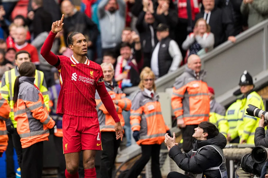 Liverpool's Virgil van Dijk celebrates after scoring their second goal during the Premier League match between Liverpool and West Ham United at Anfield in Liverpool, England, on April 13, 2025. (Photo by Steven Halliwell | MI News/NurPhoto) (Photo by MI News / NurPhoto / NurPhoto via AFP)