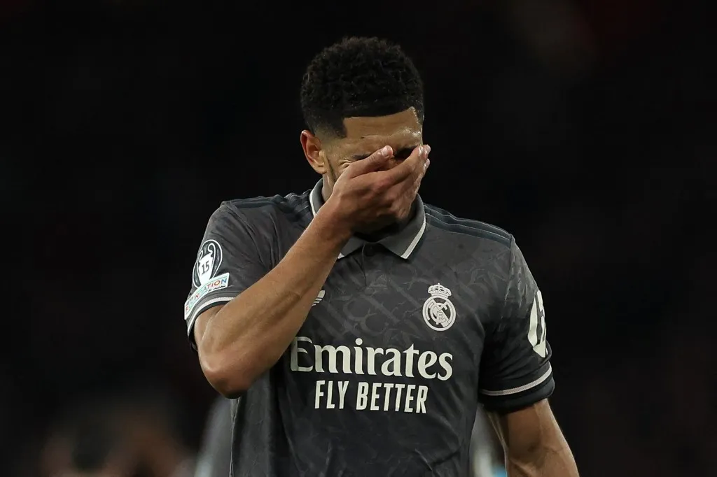 Real Madrid's English midfielder #05 Jude Bellingham reacts following the UEFA Champions League Quarter final first leg football match between Arsenal and Real Madrid, at the Emirates Stadium, in London, on April 8, 2025. (Photo by Adrian Dennis / AFP)