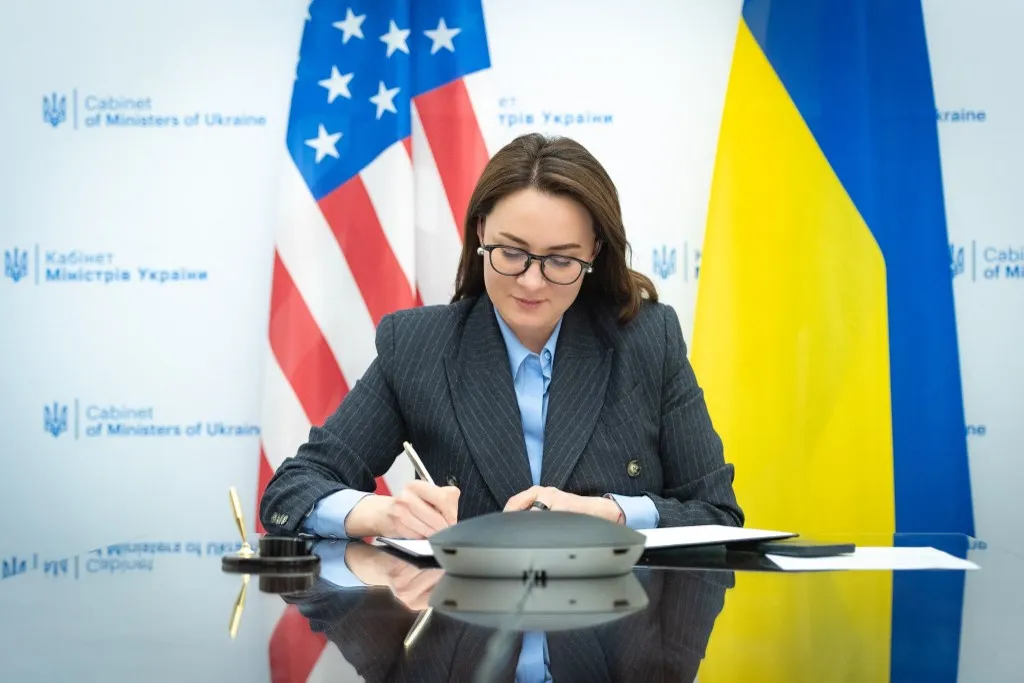 KYIV, UKRAINE - APRIL 18: (----EDITORIAL USE ONLY - MANDATORY CREDIT - 'UKRAINIAN MINISTRY OF ECONOMY / HANDOUT' - NO MARKETING NO ADVERTISING CAMPAIGNS - DISTRIBUTED AS A SERVICE TO CLIENTS----) Ukrainian Minister of Economic Development and Trade, Yulia Svyrydenko and the US Secretary of Treasury, Scott Bessent (not seen) sign the rare earth minerals deal over an online call, in Kyiv, Ukraine on April 18, 2025. Ukrainian Ministry of Economy / Handout / Anadolu (Photo by Ukrainian Ministry of Economy / / ANADOLU / Anadolu via AFP)