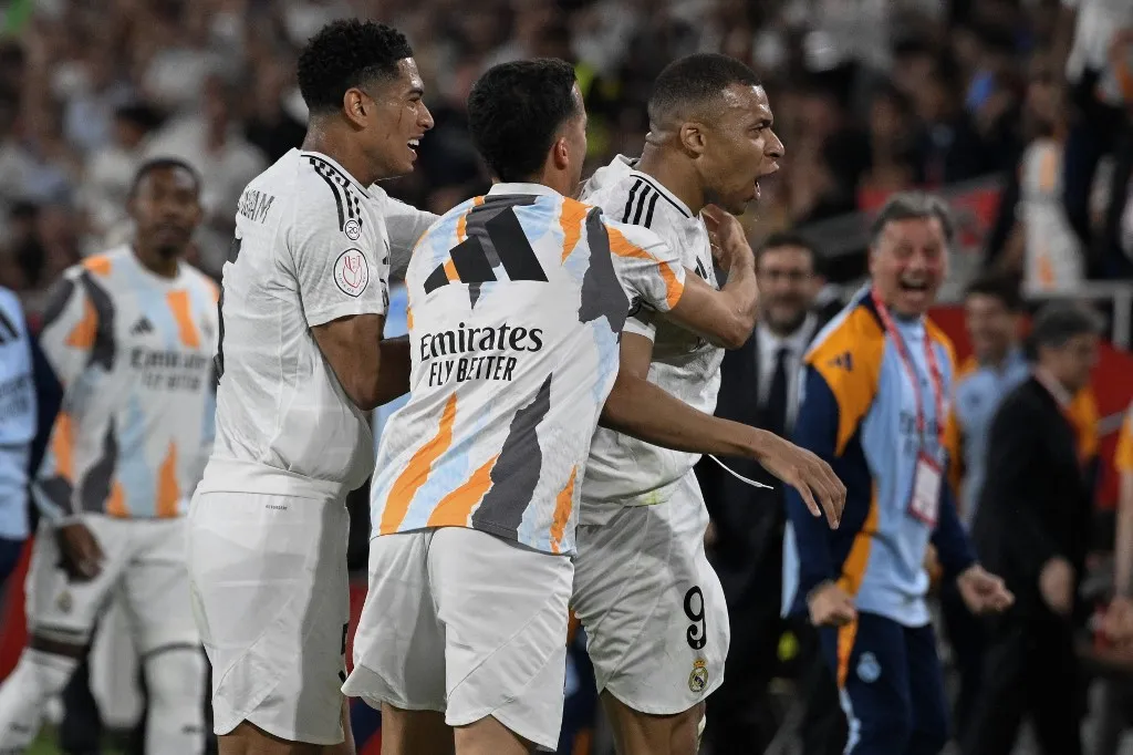 Real Madrid's French forward #09 Kylian Mbappe celebrates scoring an equalizing goal during their Spanish Cup, Copa del Rey (King's Cup) final football match between FC Barcelona and Real Madrid CF at La Cartuja stadium in Seville on April 26, 2025. (Photo by Josep LAGO / AFP)