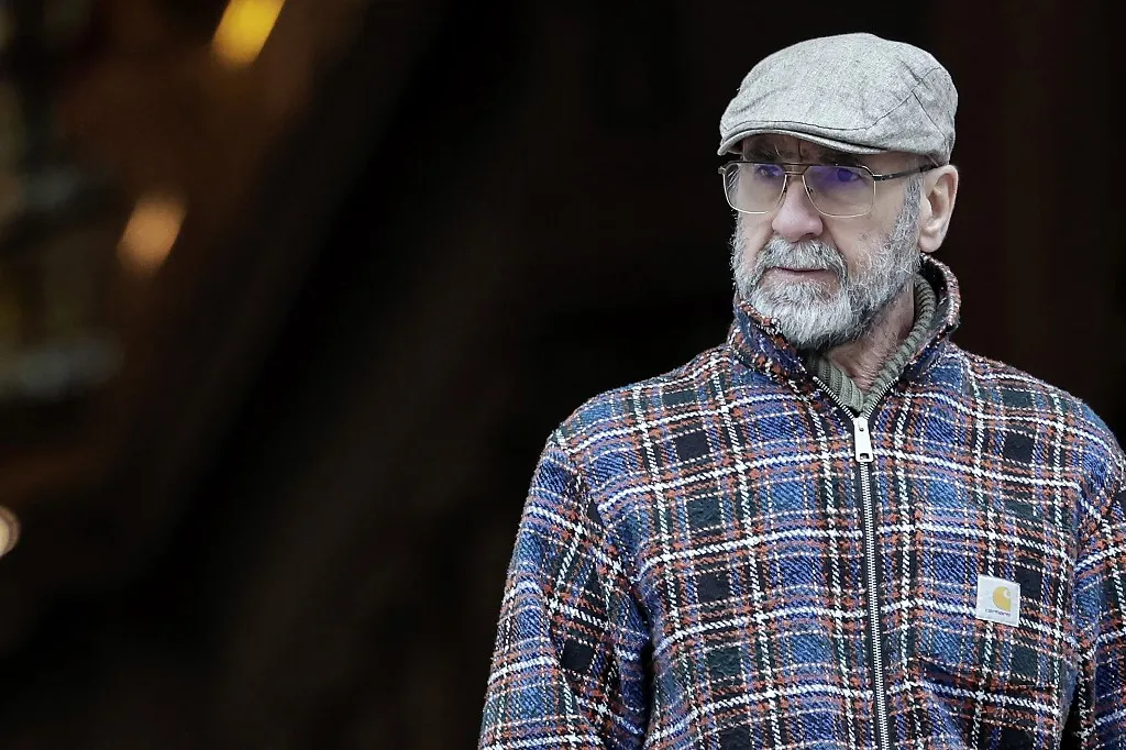 French former football player and actor Eric Cantona leaves after he attended the funeral ceremony of French-Danish actor Niels Arestrup outside the Church of Saint-Roch in Paris, on December 10, 2024. Niels Arestrup, who has died on December 1, 2024 aged 75, had been a stalwart of French theatre and cinema since the 1970s but his profile was raised internationally in the first decade of this century by two films directed by Jacques Audiard. (Photo by STEPHANE DE SAKUTIN / AFP)
