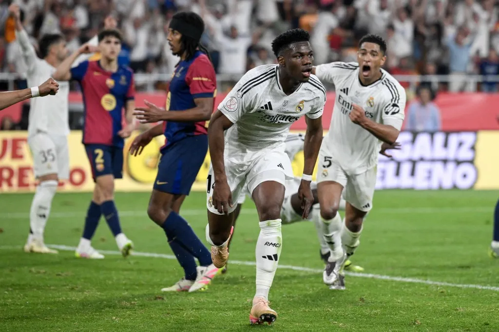 Real Madrid's French midfielder #14 Aurelien Tchouameni celebrates scoring his team's second goal during their Spanish Cup, Copa del Rey (King's Cup) final football match between FC Barcelona and Real Madrid CF at La Cartuja stadium in Seville on April 26, 2025. (Photo by Josep LAGO / AFP)