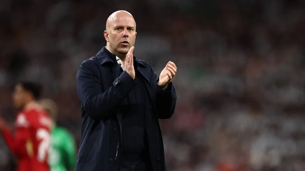 Liverpool's Dutch manager Arne Slot applauds fans on the pitch after the English League Cup final football match between Liverpool and Newcastle United at Wembley Stadium, north-west London on March 16, 2025. Newcastle won the game 2-1. (Photo by HENRY NICHOLLS / AFP) / RESTRICTED TO EDITORIAL USE. No use with unauthorized audio, video, data, fixture lists, club/league logos or 'live' services. Online in-match use limited to 120 images. An additional 40 images may be used in extra time. No video emulation. Social media in-match use limited to 120 images. An additional 40 images may be used in extra time. No use in betting publications, games or single club/league/player publications. / 
