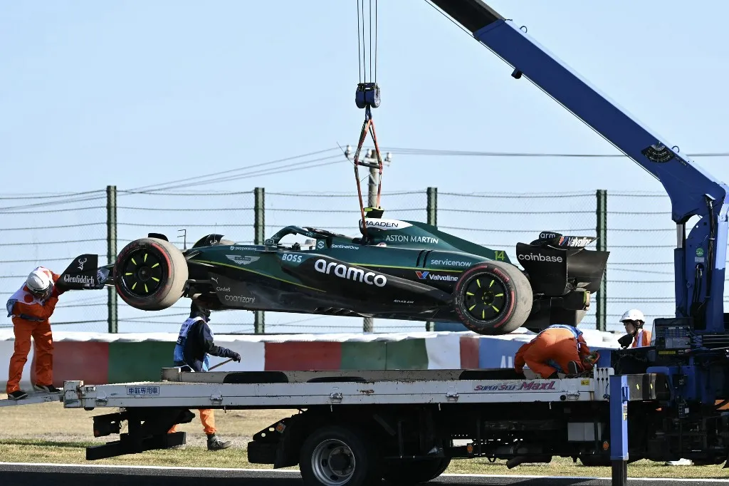 A truck transports the car of Aston Martin's Spanish driver Fernando Alonso after the second practice session of the Formula One Japanese Grand Prix at the Suzuka circuit in Suzuka, Mie prefecture on April 4, 2025. (Photo by Philip FONG / AFP)