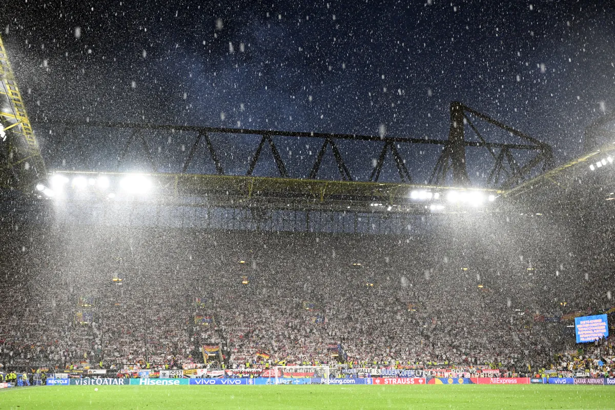 29 June 2024, North Rhine-Westphalia, Dortmund: Soccer: European Championship, Germany - Denmark, final round, round of 16, the stadium during a break in play due to bad weather. Photo: Federico Gambarini/dpa - IMPORTANT NOTE: In accordance with the regulations of the DFL German Football League and the DFB German Football Association, it is prohibited to utilize or have utilized photographs taken in the stadium and/or of the match in the form of sequential images and/or video-like photo series. (Photo by FEDERICO GAMBARINI / DPA / dpa Picture-Alliance via AFP)