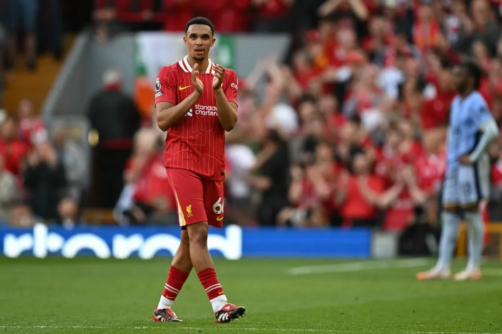 Liverpool's English defender #66 Trent Alexander-Arnold applauds as he is substituted during the English Premier League football match between Liverpool and Tottenham Hotspur at Anfield in Liverpool, north west England on April 27, 2025. (Photo by Paul ELLIS / AFP) / RESTRICTED TO EDITORIAL USE. No use with unauthorized audio, video, data, fixture lists, club/league logos or 'live' services. Online in-match use limited to 120 images. An additional 40 images may be used in extra time. No video emulation. Social media in-match use limited to 120 images. An additional 40 images may be used in extra time. No use in betting publications, games or single club/league/player publications. / 