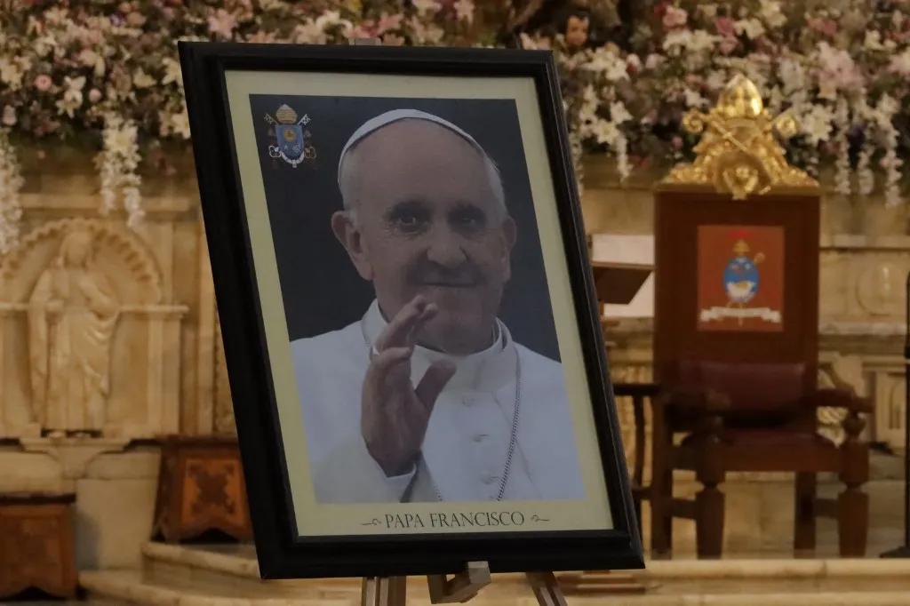 An image of Pope Francis is on an altar during a mass at the Metropolitan Cathedral in Mexico City, Mexico, on April 24, 2025, to bid farewell to Pope Francis before his burial, which takes place at the Basilica of Saint Mary Major. Pope Francis dies on Monday, April 21, of a stroke, one day after his final public appearance on Sunday in St. Peter's Square. (Photo by Luis Barron/Eyepix Group) (Photo by Eyepix/NurPhoto) (Photo by Eyepix / NurPhoto / NurPhoto via AFP)