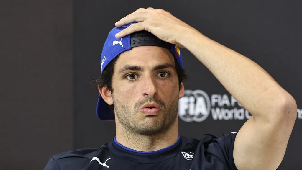 Williams' Spanish driver Carlos Sainz reacts during a press conference at the Bahrain International Circuit in Sakhir on April 10, 2025, ahead of the Bahrain Formula One Grand Prix weekend. (Photo by Fadel SENNA / AFP)
