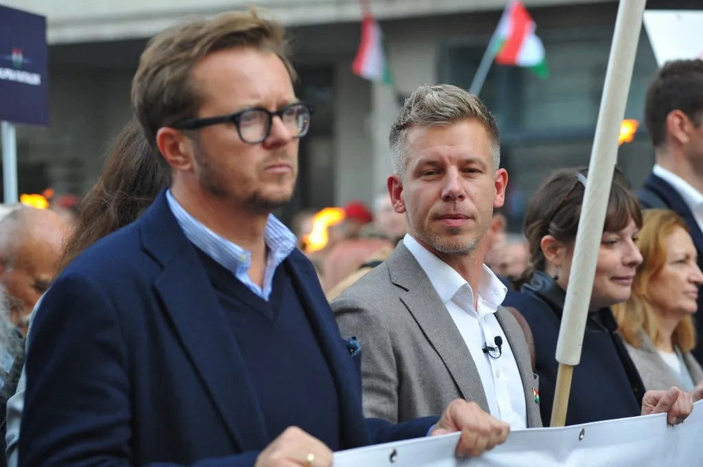 Michal Wawrykiewicz, Polish MEP (left), and Peter Magyar, Hungarian MEP (right), attend a memorial held by the Tisza Party on the anniversary of the 1956 Hungarian Revolution. (Photo by Balint Szentgallay/NurPhoto) (Photo by Balint Szentgallay / NurPhoto / NurPhoto via AFP)