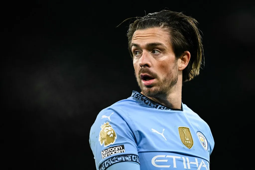 Manchester City's English midfielder #10 Jack Grealish reacts during the English Premier League football match between Manchester City and West Ham United at the Etihad Stadium in Manchester, north west England, on January 4, 2025. (Photo by Oli SCARFF / AFP) / RESTRICTED TO EDITORIAL USE. No use with unauthorized audio, video, data, fixture lists, club/league logos or 'live' services. Online in-match use limited to 120 images. An additional 40 images may be used in extra time. No video emulation. Social media in-match use limited to 120 images. An additional 40 images may be used in extra time. No use in betting publications, games or single club/league/player publications. / 