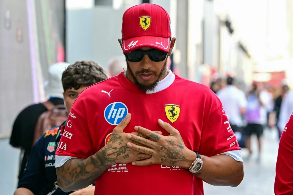 Ferrari's British driver Lewis Hamilton arrives to the paddock ahead of the 2025 Saudi Arabia Formula One Grand Prix at the Jeddah Corniche Circuit on April 20, 2025. (Photo by Giuseppe CACACE / AFP)