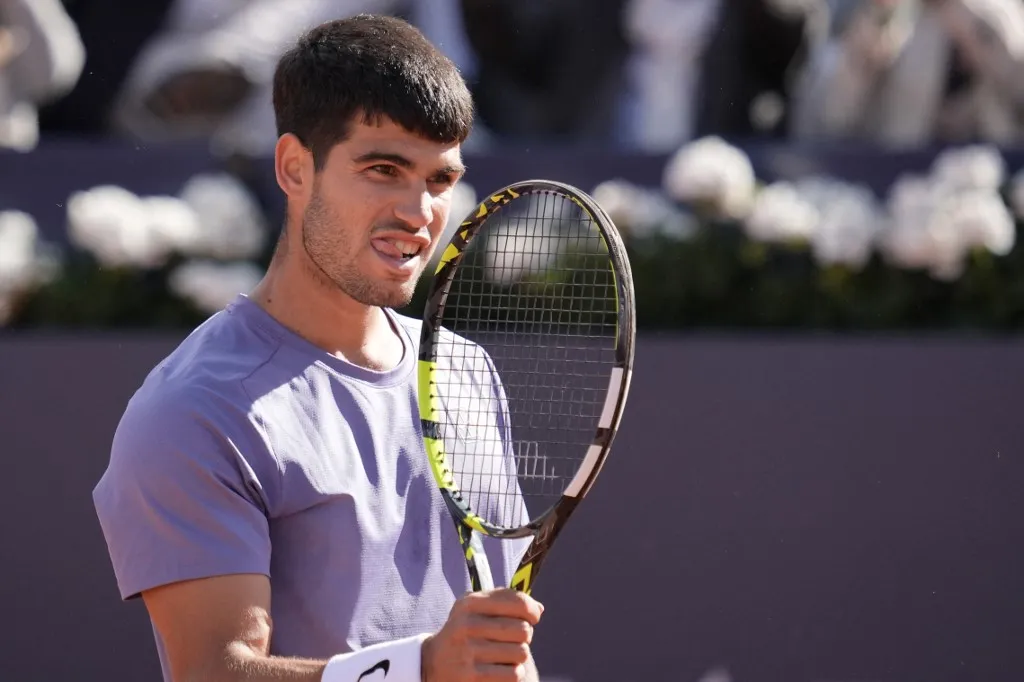 Spain's Carlos Alcaraz celebrates beating France's Arthur Fils during the ATP Barcelona Open "Conde de Godo" tennis tournament singles semi-final match at the Real Club de Tenis in Barcelona, on April 19, 2025. (Photo by MANAURE QUINTERO / AFP)