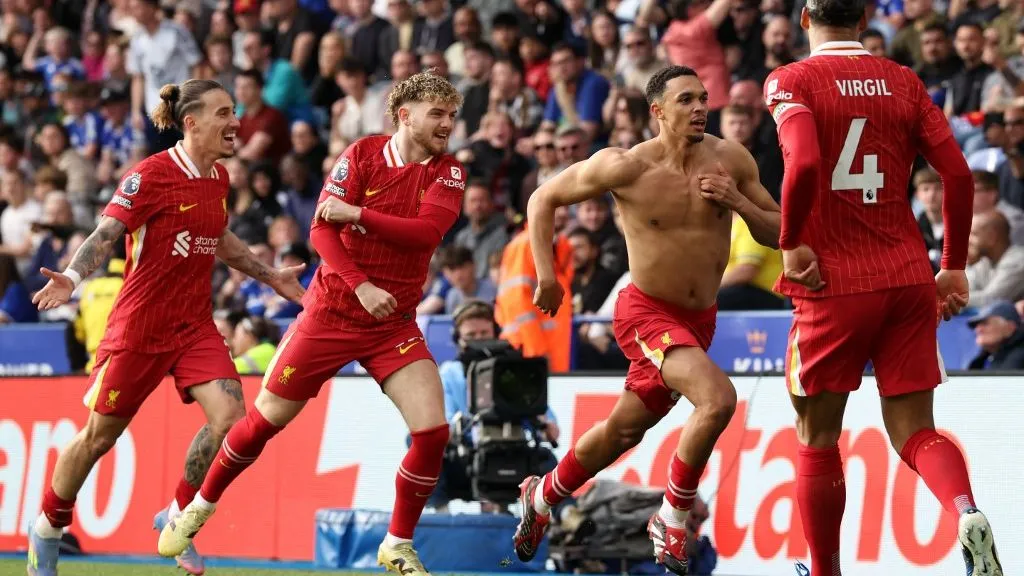 Liverpool's English defender #66 Trent Alexander-Arnold (2R) celebrates after scoring the opening goal of the English Premier League football match between Leicester City and Liverpool at King Power Stadium in Leicester, central England on April 20, 2025. (Photo by Darren Staples / AFP) / RESTRICTED TO EDITORIAL USE. No use with unauthorized audio, video, data, fixture lists, club/league logos or 'live' services. Online in-match use limited to 120 images. An additional 40 images may be used in extra time. No video emulation. Social media in-match use limited to 120 images. An additional 40 images may be used in extra time. No use in betting publications, games or single club/league/player publications. / 