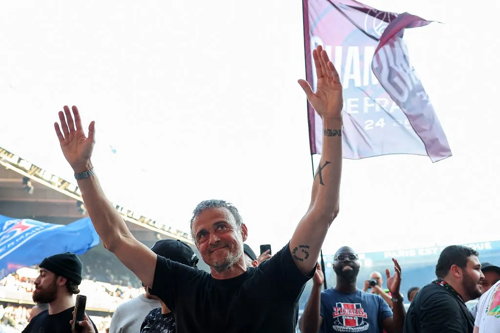 Paris Saint-Germain's Spanish headcoach Luis Enrique celebrates after winning the match and the French championship title following the French L1 football match between Paris Saint-Germain (PSG) and SCO Angers at The Parc des Princes Stadium in Paris on April 5, 2025. Paris Saint-Germain clinched the Ligue 1 title on Saturday with a 1-0 win at home against Angers as they prepare for a Champions League quarter-final showdown with Aston Villa. PSG needed just a draw at home to their struggling opponents to be confirmed as champions again, having started the day a huge 21 points clear of nearest challengers Monaco with seven matches left. (Photo by FRANCK FIFE / POOL / AFP)