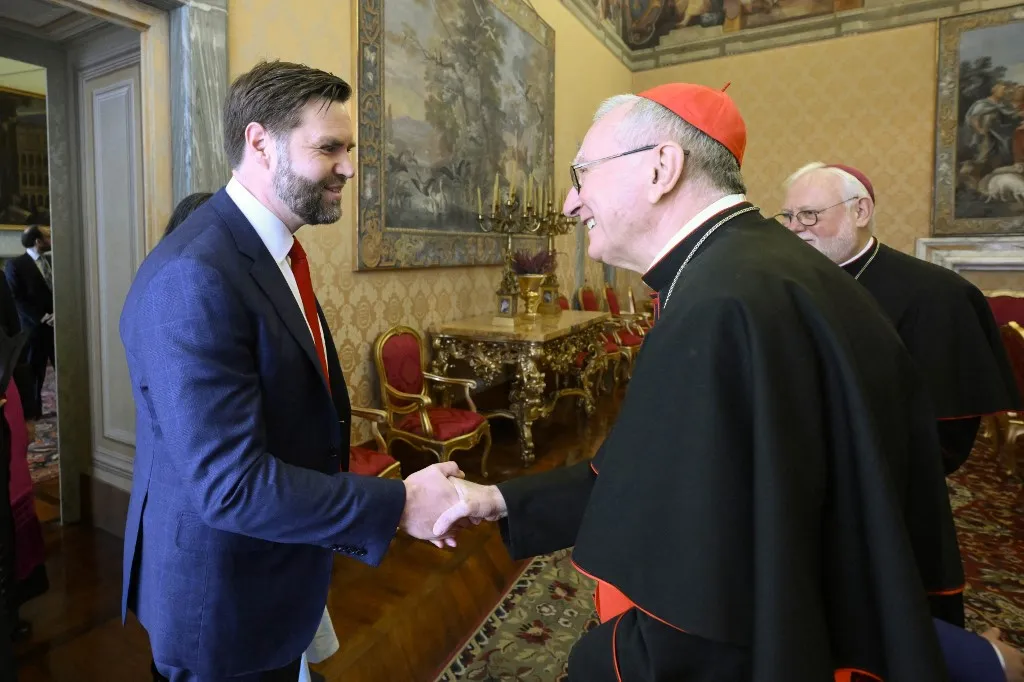 This photo taken and handout on April 19, 2025 by The Vatican Media shows The Vatican's Cardinal Secretary of State Pietro Parolin welcoming US Vice-President JD Vance at the Vatican. (Photo by Handout / VATICAN MEDIA / AFP) / RESTRICTED TO EDITORIAL USE - MANDATORY CREDIT "AFP PHOTO / VATICAN MEDIA" - NO MARKETING - NO ADVERTISING CAMPAIGNS - DISTRIBUTED AS A SERVICE TO CLIENTS