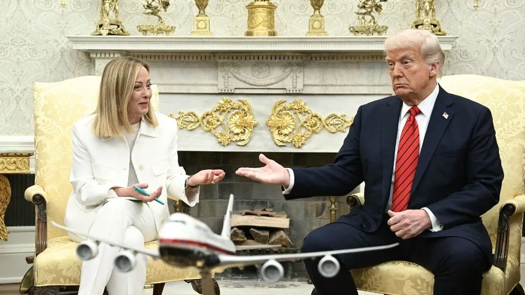 US President Donald Trump meets with Italian Prime Minister Giorgia Meloni in the Oval Office of the White House in Washington, DC, on April 17, 2025. Italy's Prime Minister Giorgia Meloni meets with Donald Trump Thursday in Washington, hoping a personal charm offensive can help convince the US president to cut a more favourable deal on EU tariffs. (Photo by Brendan SMIALOWSKI / AFP)