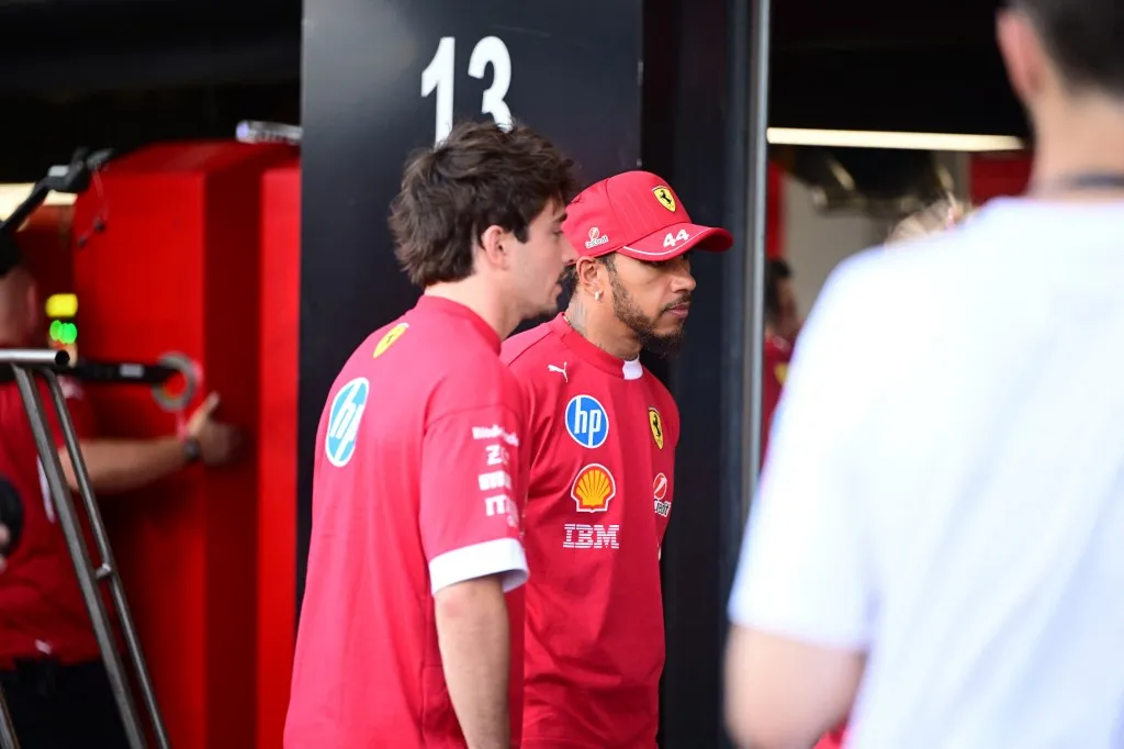 Lewis Hamilton, Charles Leclerc, and Maya Weug of Scuderia Ferrari chat during media day of the Saudi Arabia GP, the 5th round of the Formula 1 World Championship at Jeddah Corniche Circuit in Jeddah, Saudi Arabia, on April 17, 2025. (Photo by Andrea Diodato/NurPhoto) (Photo by Andrea Diodato / NurPhoto / NurPhoto via AFP)