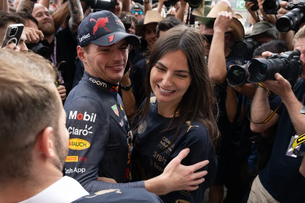 Red Bull Racing's Dutch driver Max Verstappen (C) hugs his girlfriend Kelly Piquet as the Red Bull Racing team celebrates winning the Constructors title and the Formula One United States Grand Prix, at the Circuit of the Americas in Austin, Texas, on October 23, 2022. (Photo by Jim WATSON / AFP)